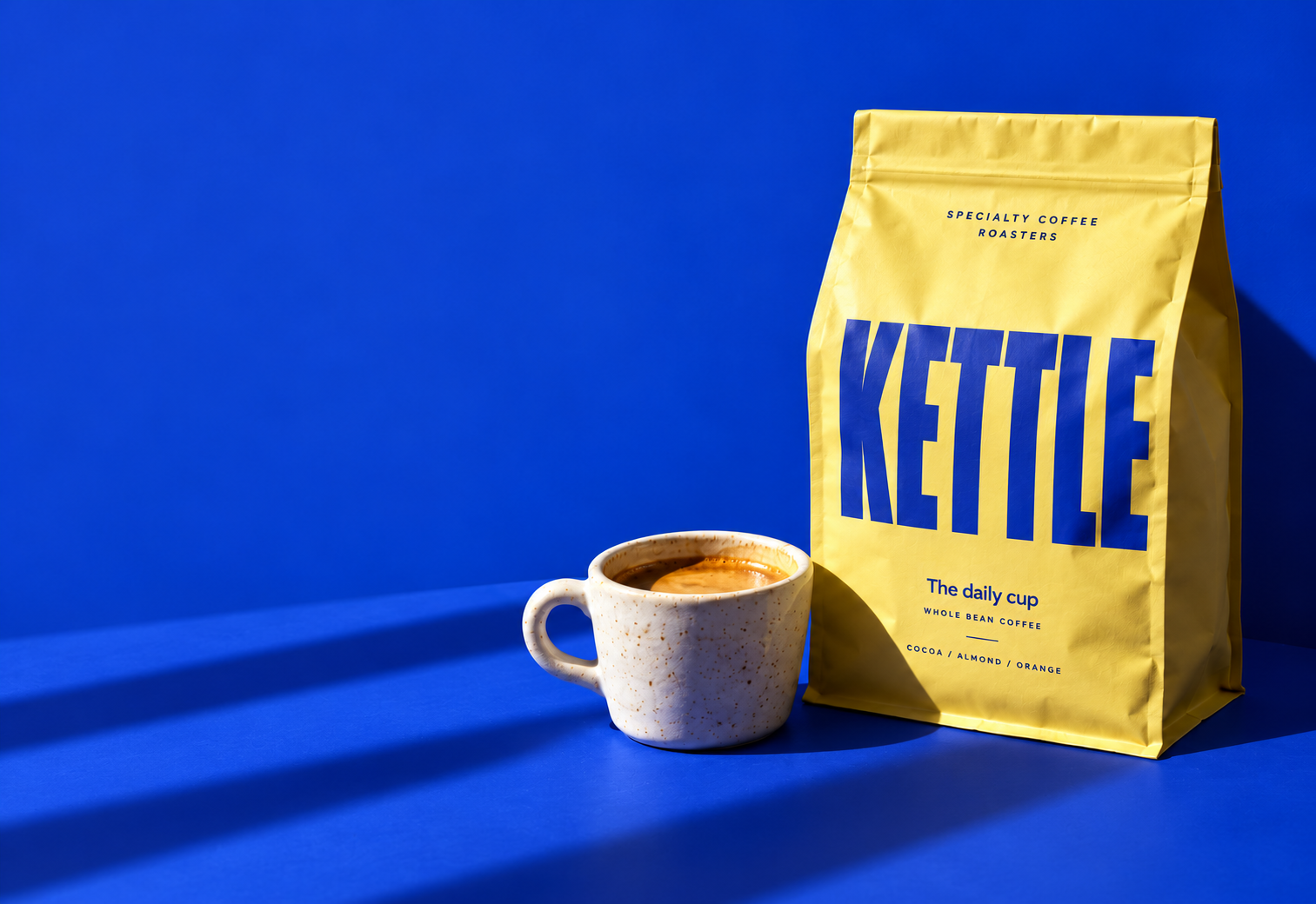 AI-generated yellow KETTLE coffee bag and espresso cup on cobalt blue